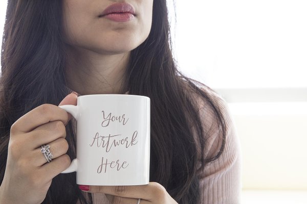 Download Woman holding blank mug mockup
